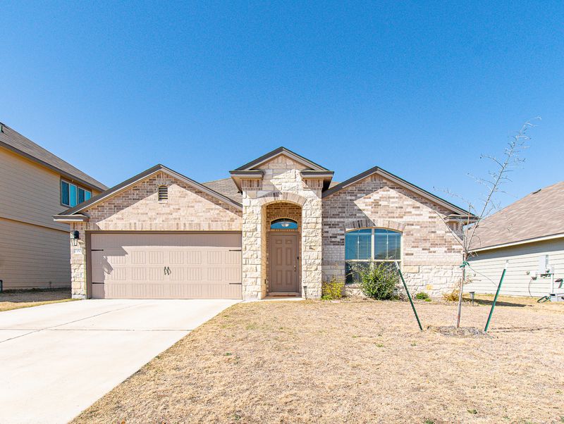 Single-story brick and stone home exterior
